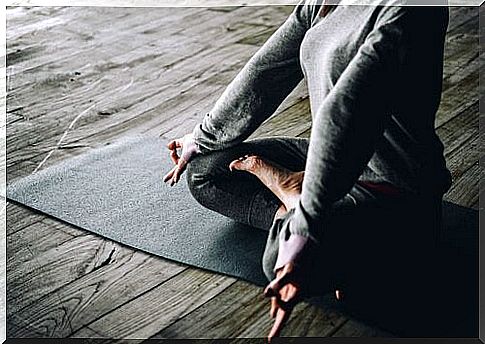 woman practicing yoga at home