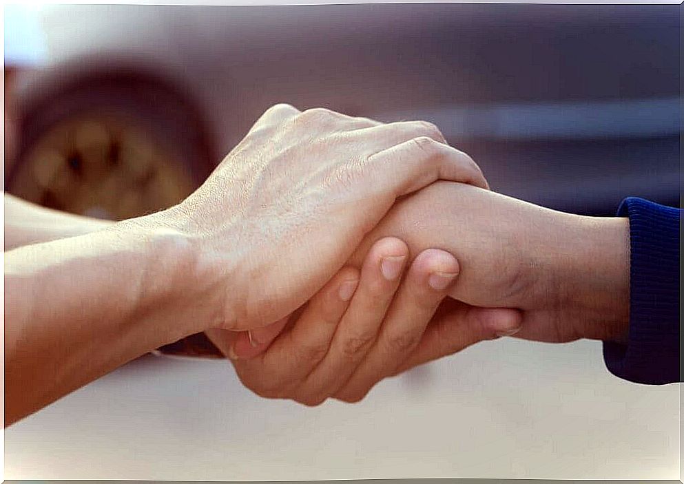 Two people shaking hands. 