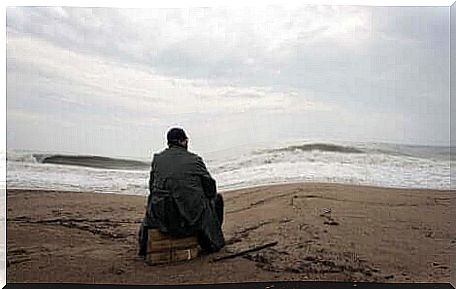 A man at the beach with acute stress disorder.