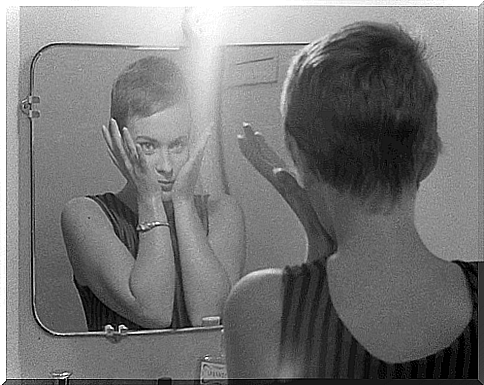 woman in front of a mirror