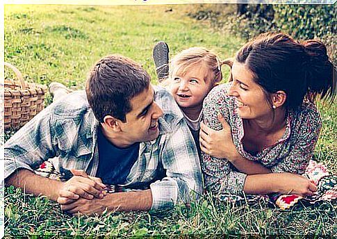 parents with their daughter in a field