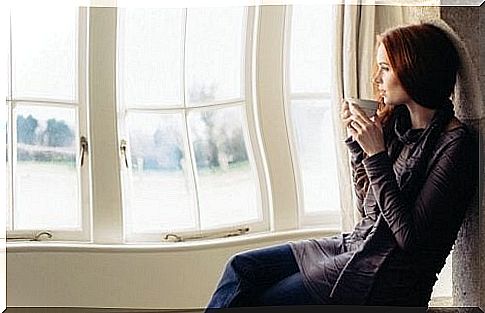 woman looking out the window