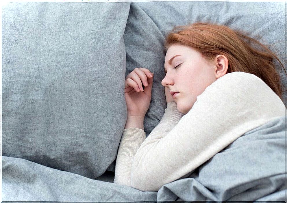 A teenage girl sleeping.